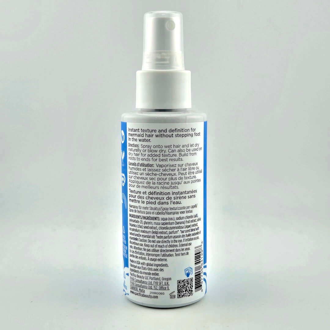 Spray bottle with label on a gray background