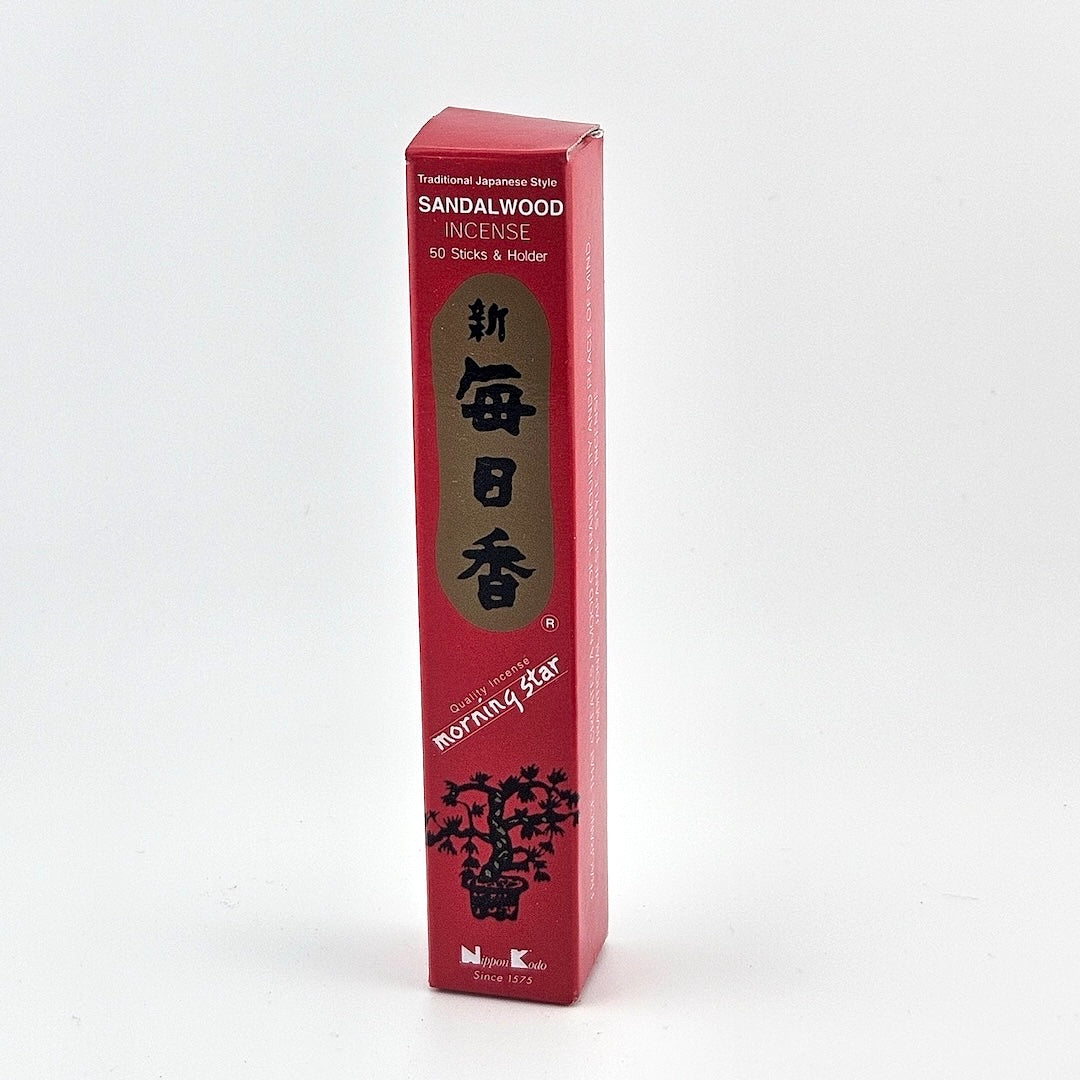 red box of 50 incense sticks with Japanese writing above bonsai tree packaging on gray background.