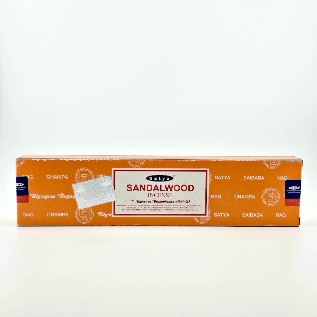 Orange box with white company printed all over, white label with red border with product details, silver holographic sticker beside.