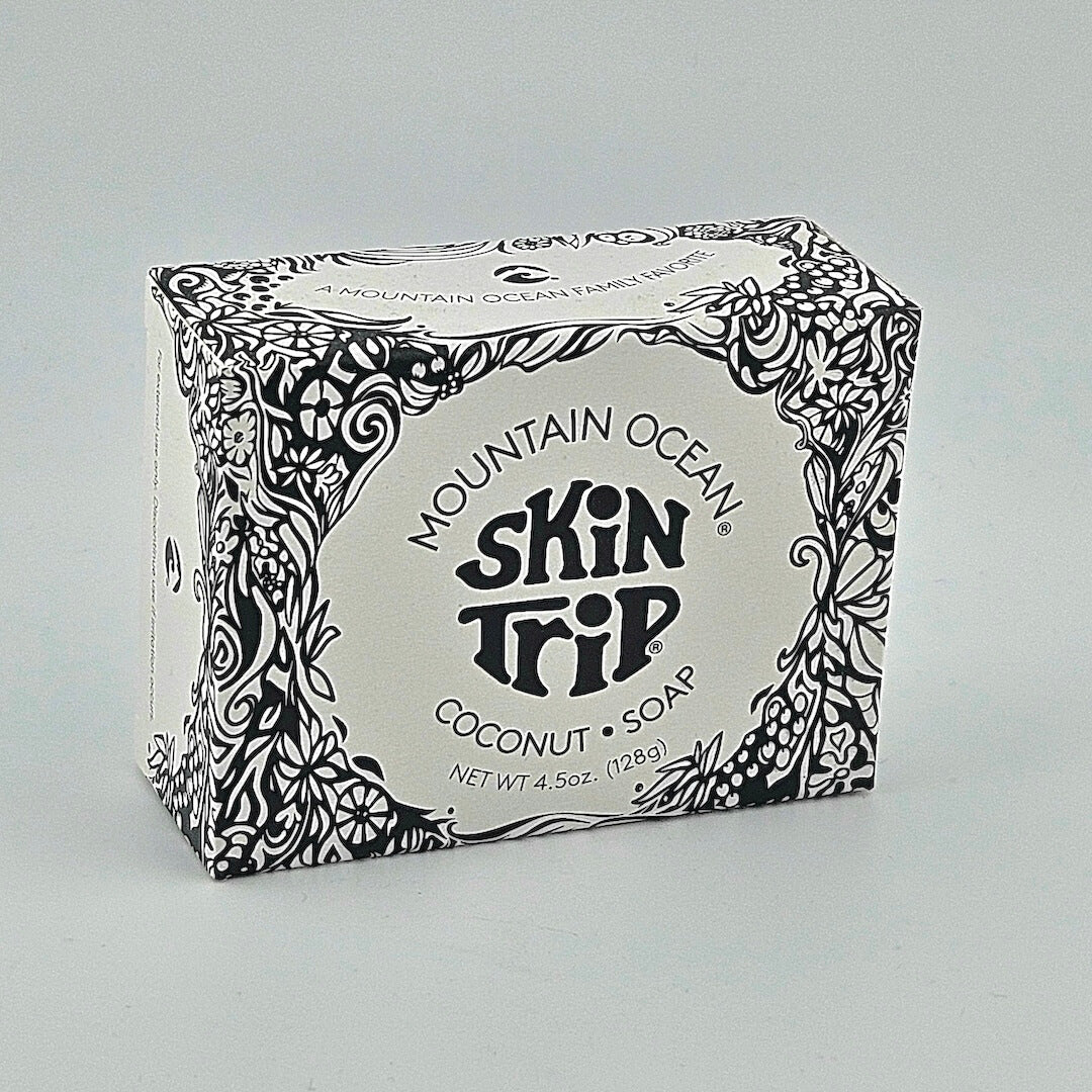 Box of Mountain Ocean Skin Trip Coconut Soap with decorative black patterns on a gray background