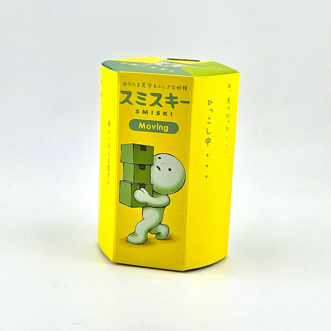 Yellow box with a green character on a white background