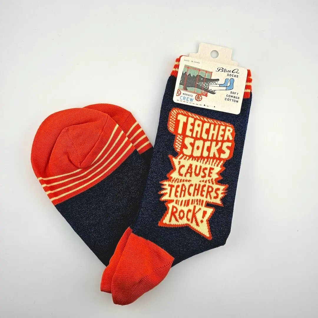 Pair of socks with red and orange design on a white background