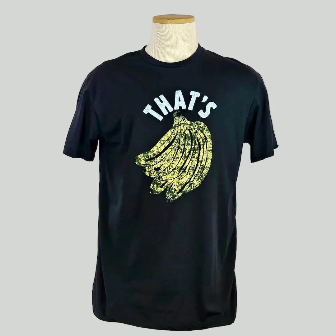 Black t-shirt with yellow banana graphic and 'THAT'S' text on a mannequin against a white background