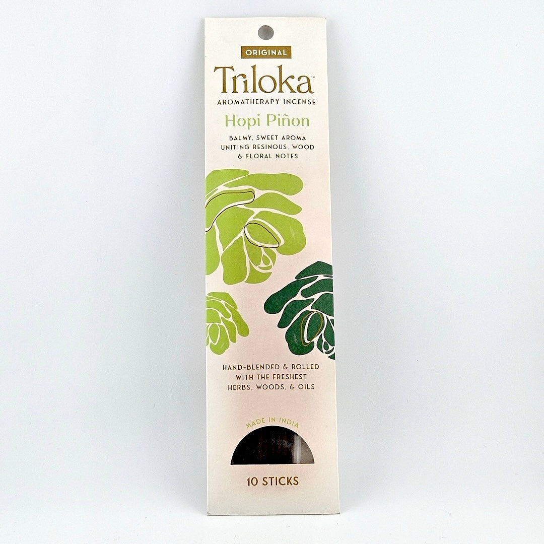 White rectangular package for 10 incense sticks, three blossoms in center framed by product information.