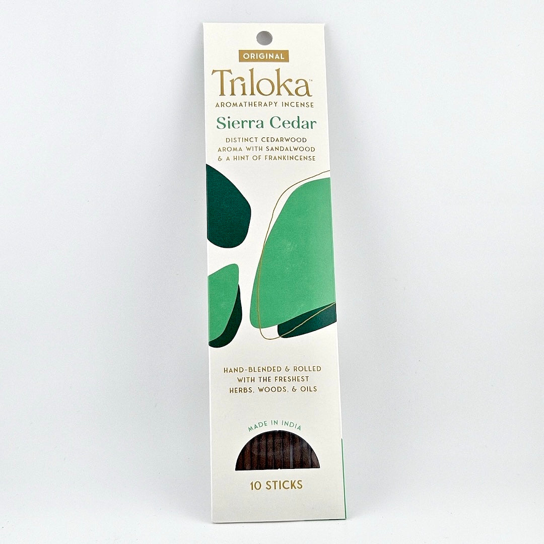 White rectangular package for 10 incense sticks, three leaves in center framed by product information.