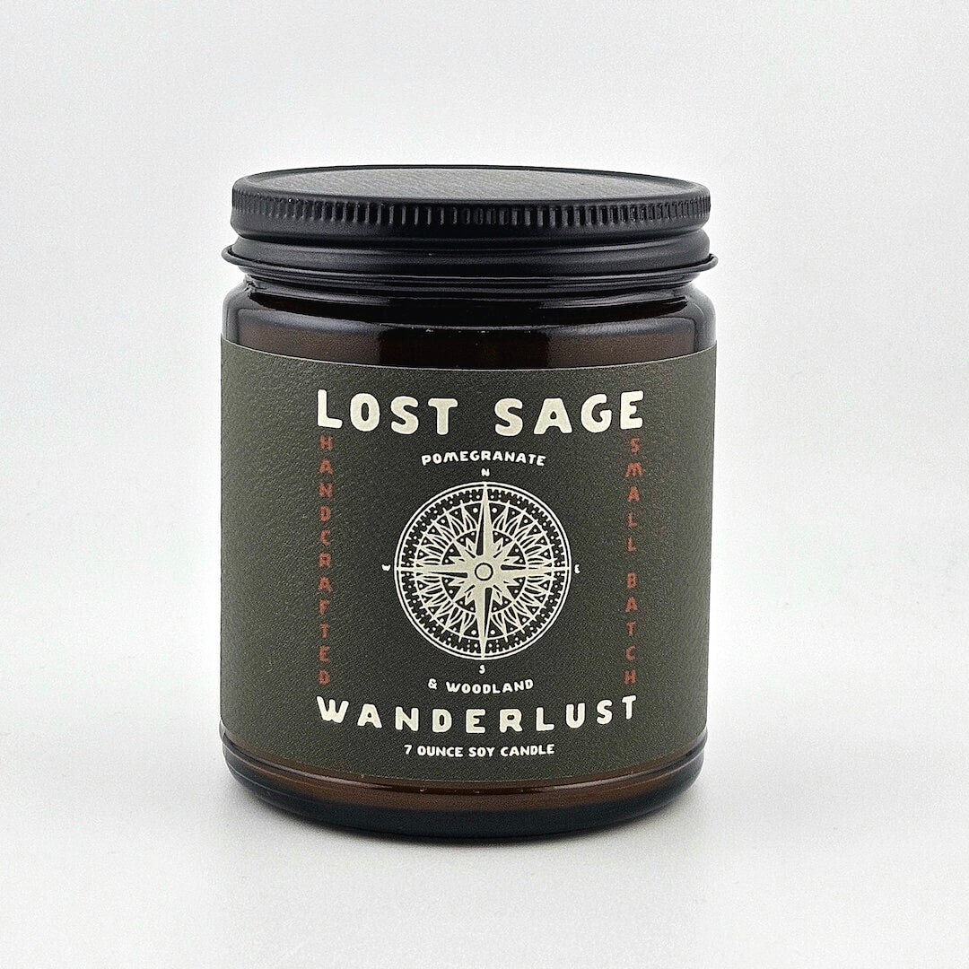 Candle jar labeled 'Lost Sage Wanderlust' on a white background