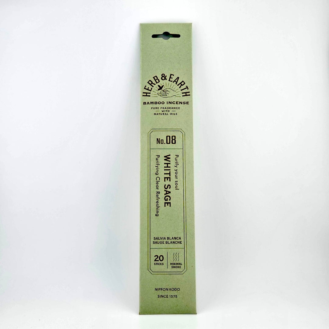 Light sage green rectangular package of incense with brown text describing product.