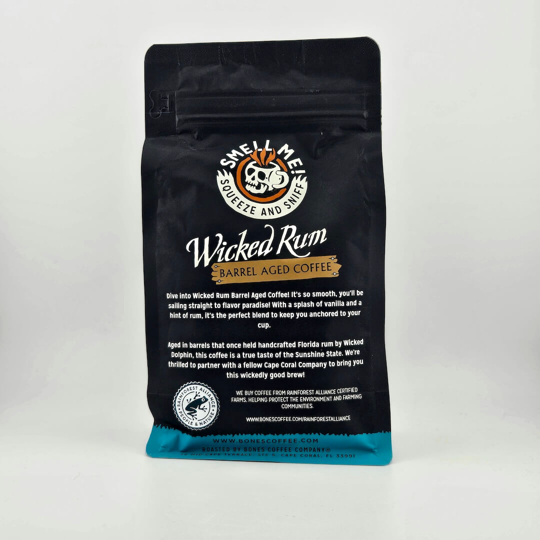 Black coffee bag with 'Wicked Rum' branding on a white background