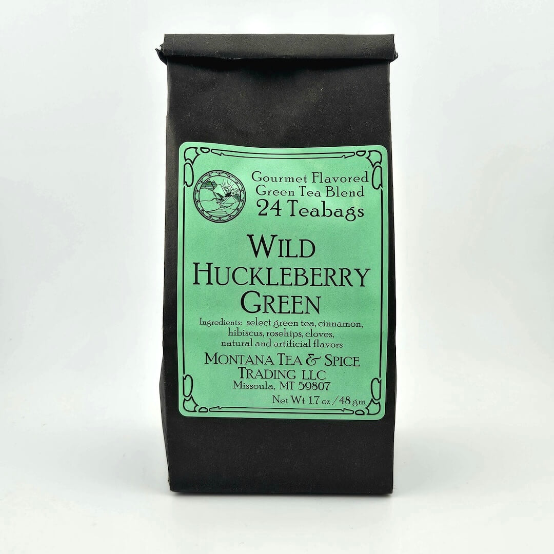 Black paper bag with rolled top with sage-green label describing flavor and ingredients.