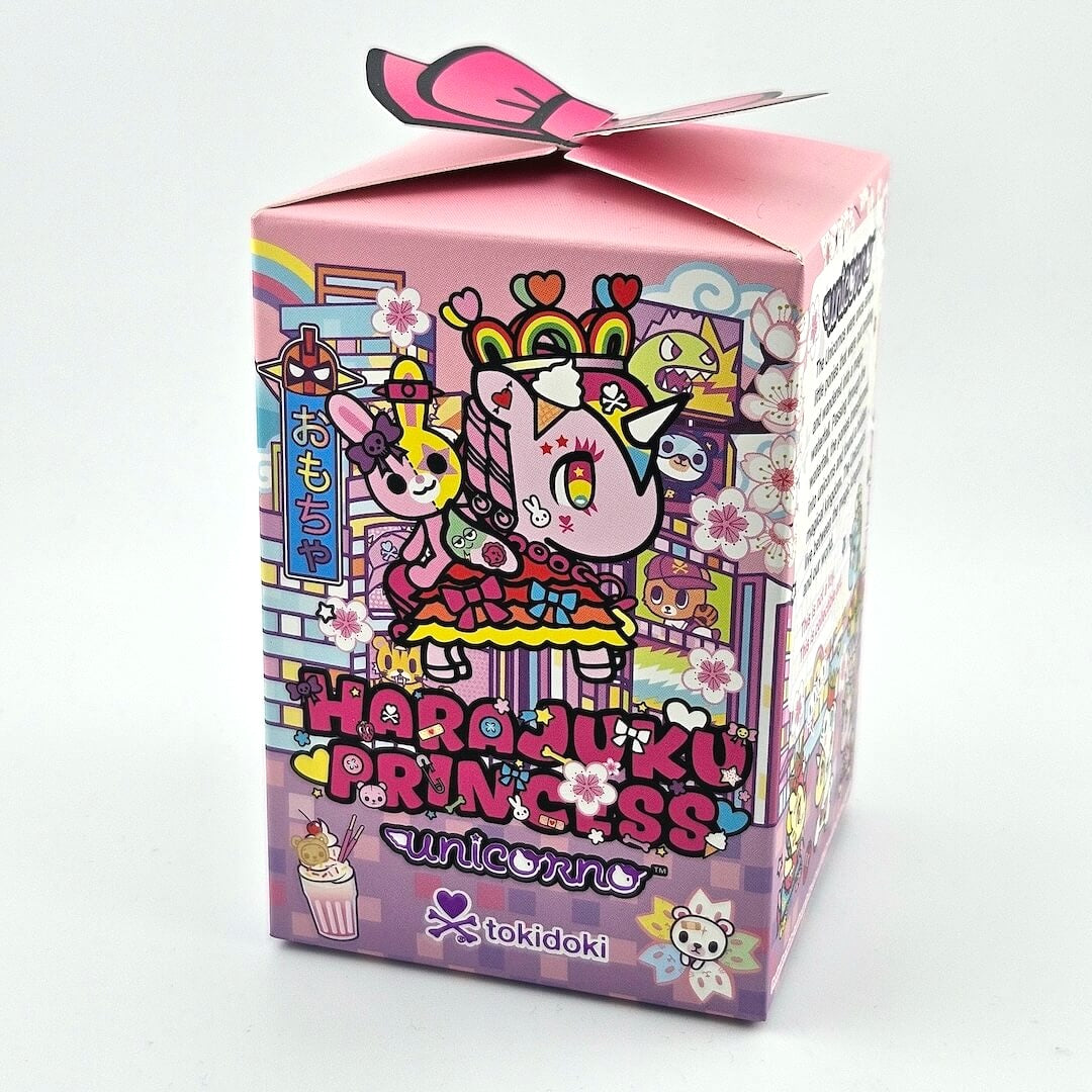 Colorful packaging box with cartoon characters and text on a white background