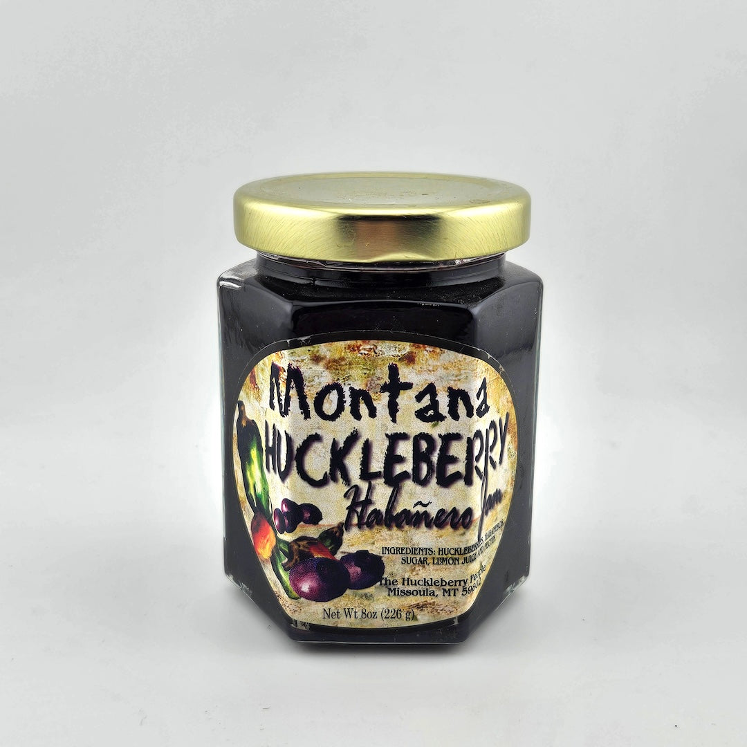 Jar of Montana Huckleberry Habanero Jam against white background.