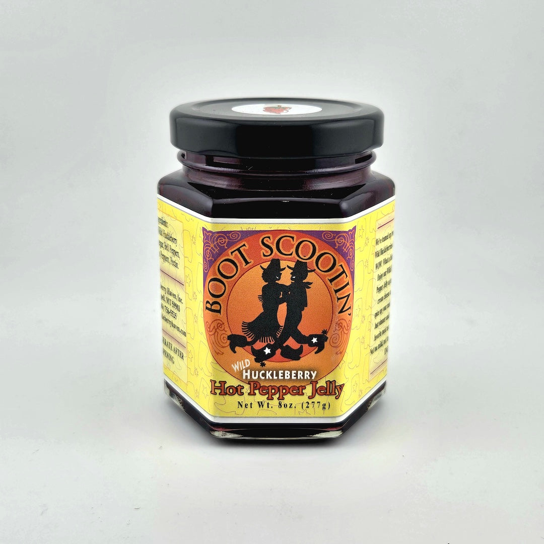 Jar of Boot Scootin Huckleberry Hot Pepper Jelly on a white background