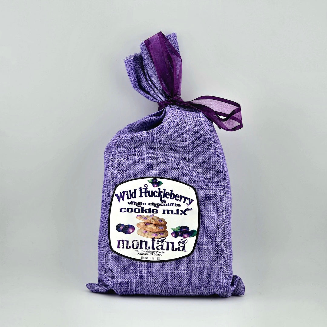 Purple bag of Wild Huckleberry cookie mix with a label on a light gray background
