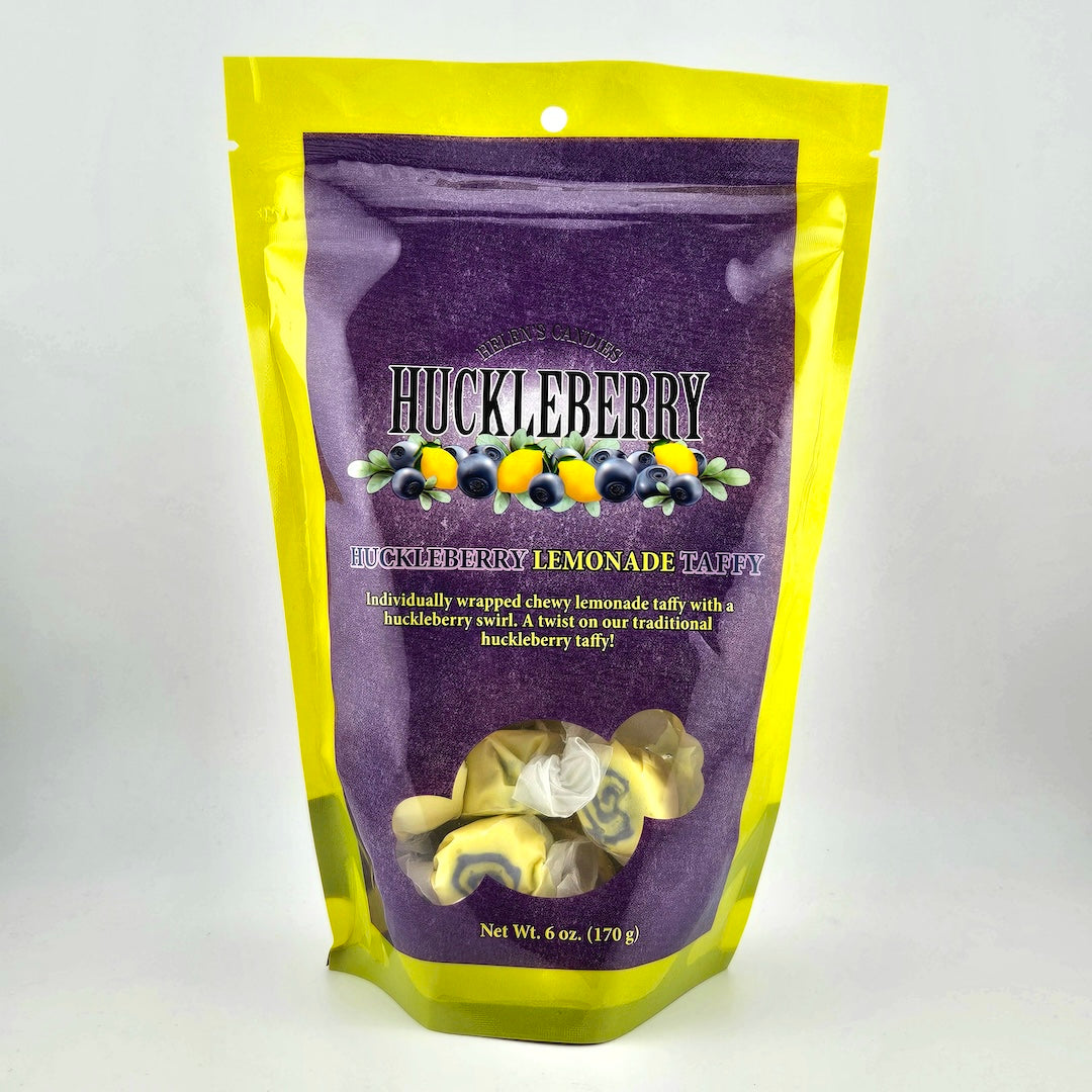 Huckleberry lemonade taffy package with purple and yellow design on a white background