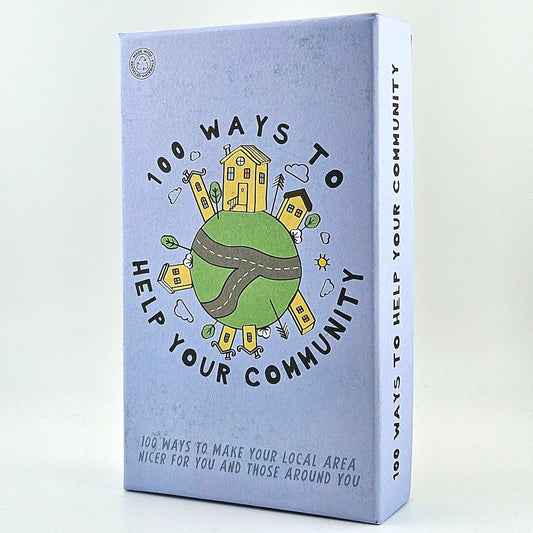 Purple box of cards titles "100 Ways to Help Your Community" with house and globe illustrations against white background.
