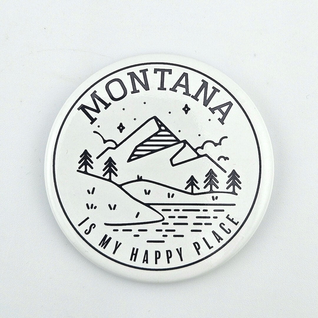 Round coaster with 'Montana is my happy place' text and mountain design on a white background