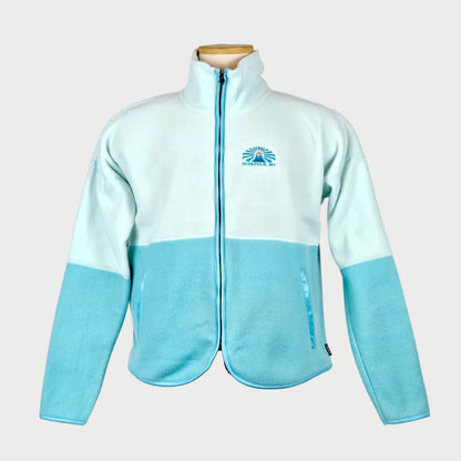 Light blue and white fleece jacket on a mannequin against a plain background
