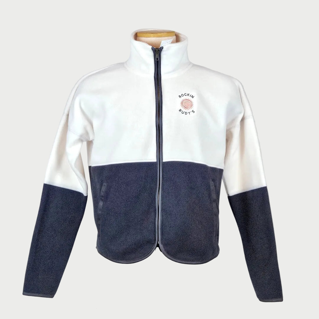 Two-tone white and navy fleece jacket on a mannequin against a plain background