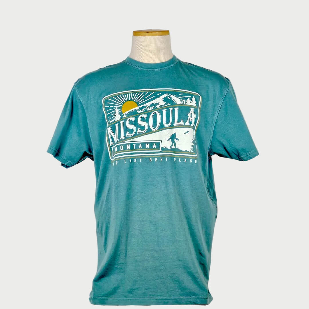 Teal t-shirt with 'Missoula Montana' graphic on a mannequin against a white background
