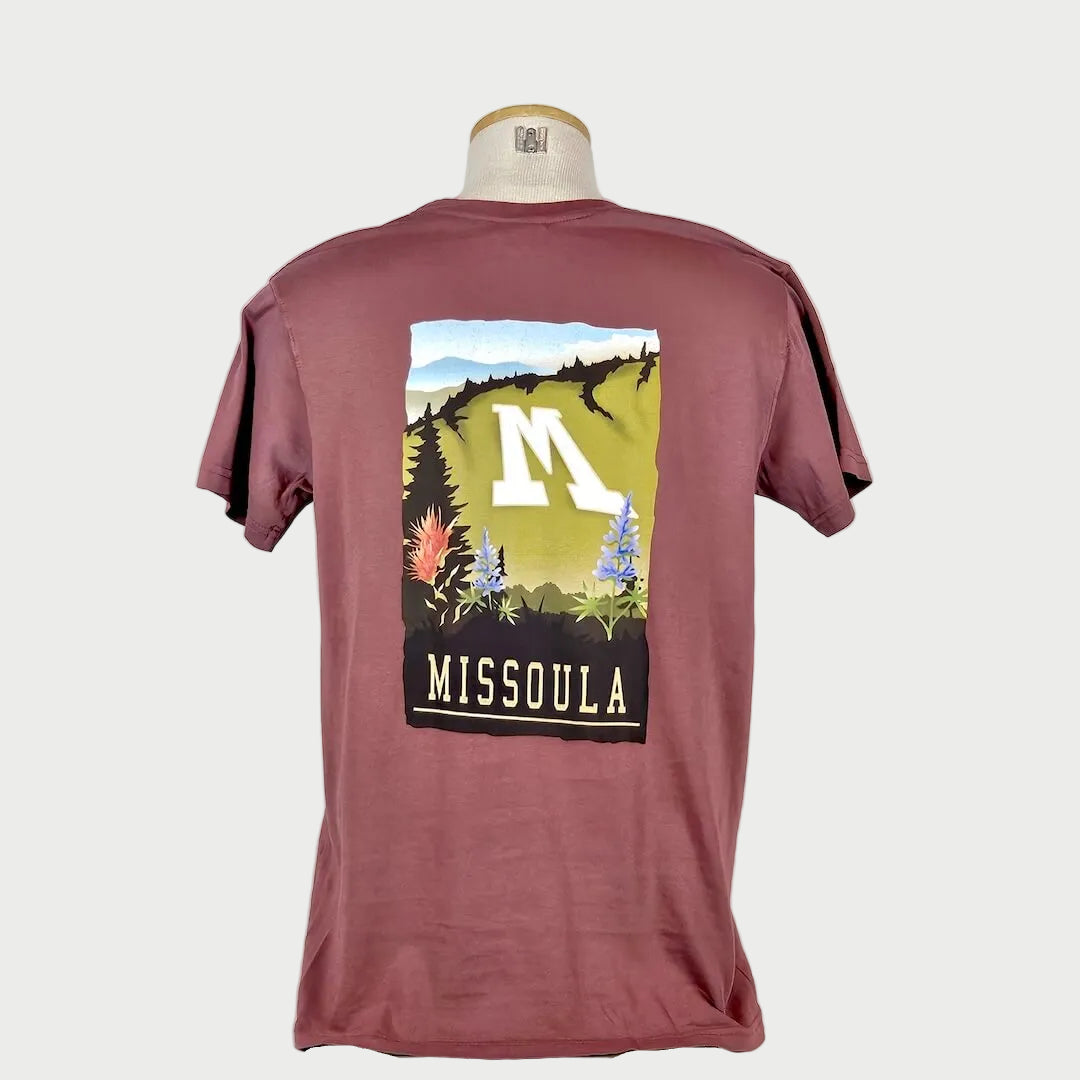 Maroon t-shirt with 'Missoula' graphic on a mannequin against a white background