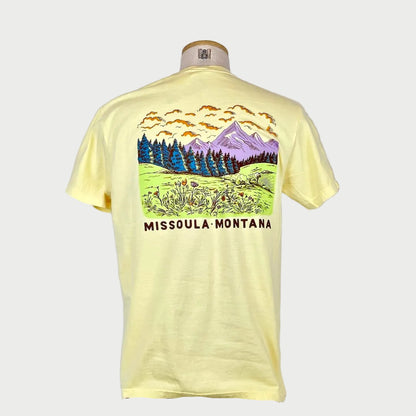 Yellow t-shirt with a graphic design and 'Missoula, Montana' text on a white background