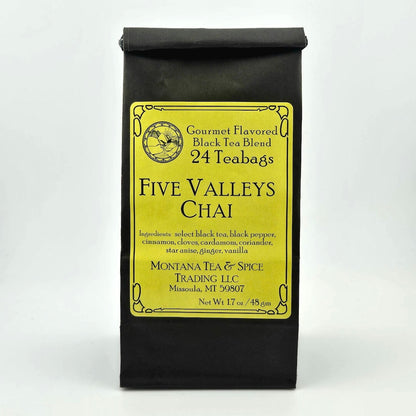 Black paper bag with rolled top with yellow label describing flavor and ingredients. 