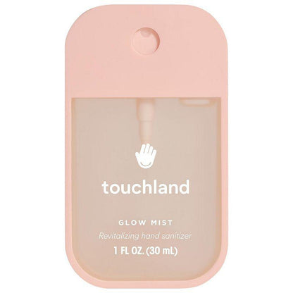 Pink spray hand sanitizer against white background. 