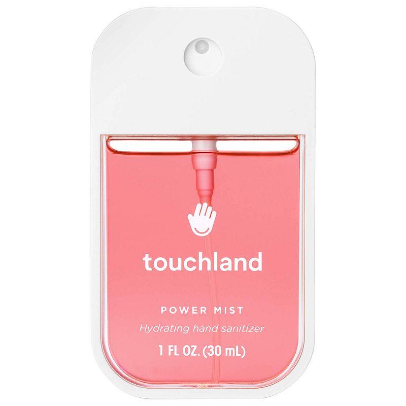 Pink hand sanitizer in white packaging against white background. 