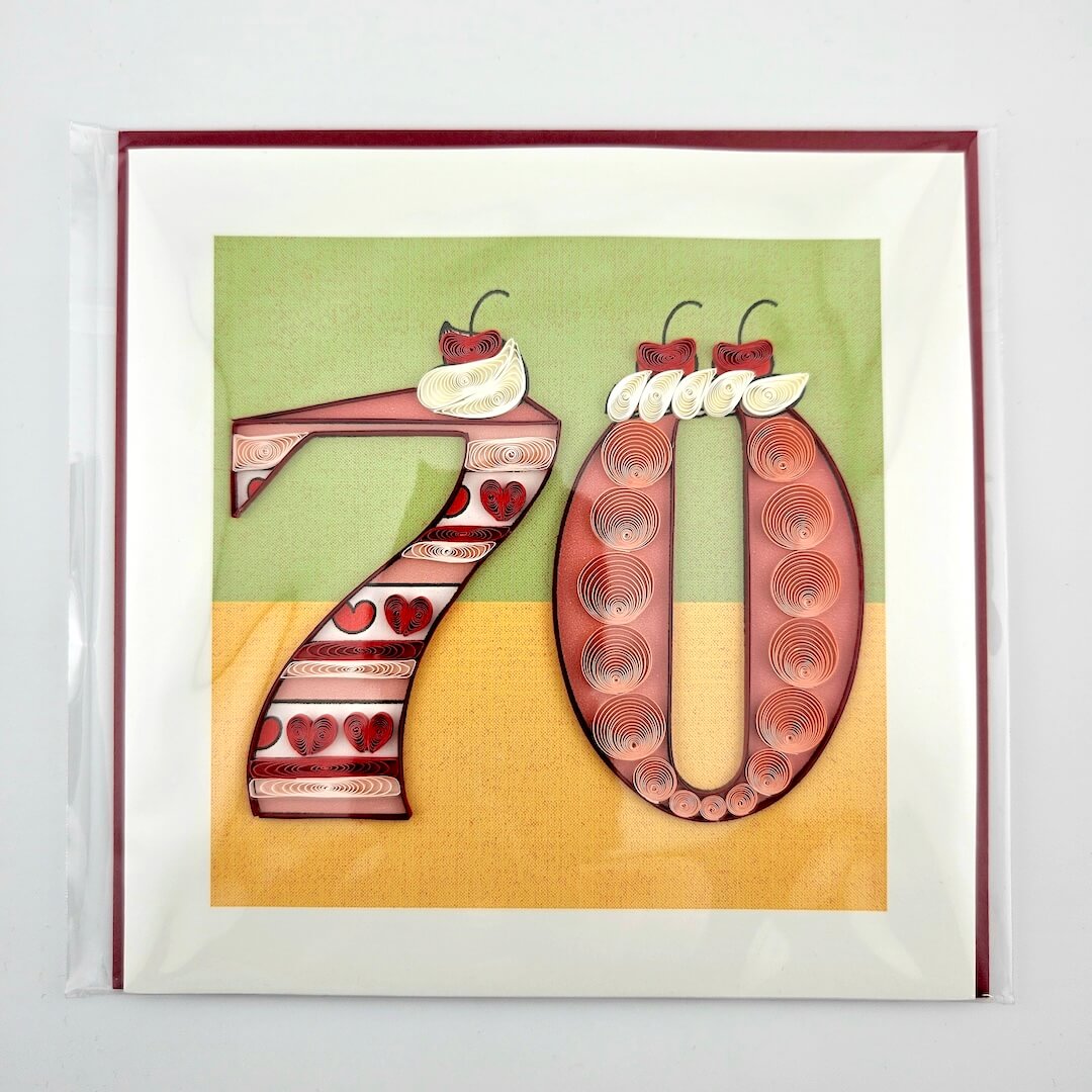 Framed artwork with decorative numbers '70' on a colorful background