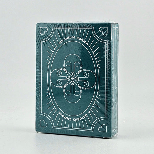 Green deck of cards with white design and text on a light gray background