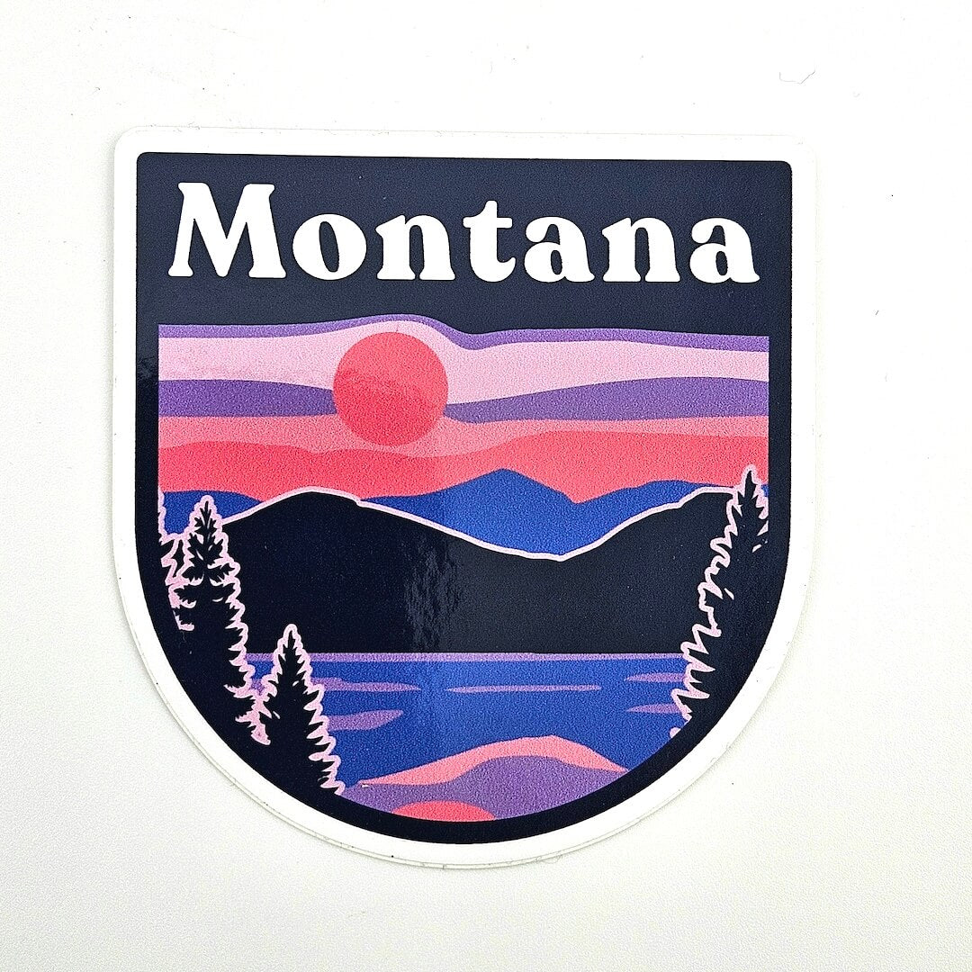 Sticker with 'Montana' text and a scenic design on a white background