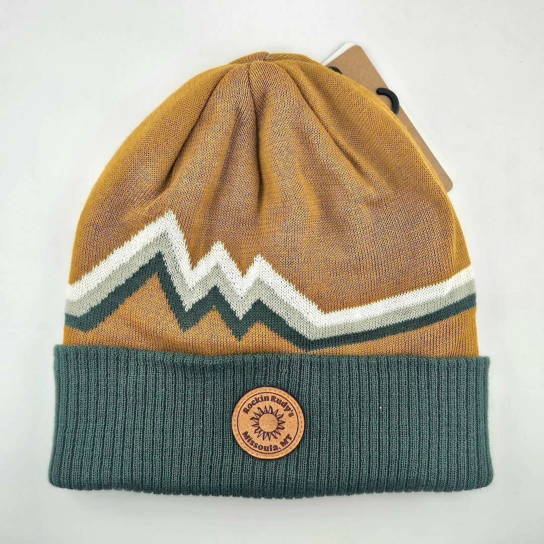 Knitted beanie with mountain design and brand logo on a white background