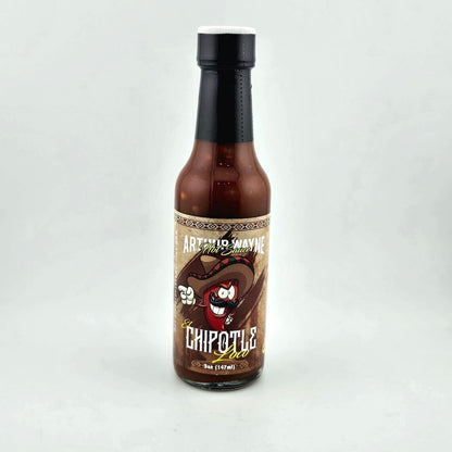 Glass bottle of hot sauce safety sealed with plastic. Label across main body of bottle details flavor and image depicting it. 