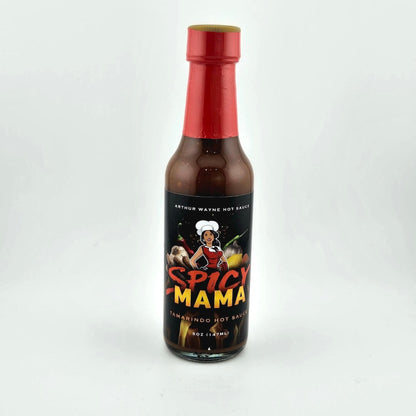 Glass bottle of hot sauce safety sealed with plastic. Label across main body of bottle details flavor and image depicting it. 