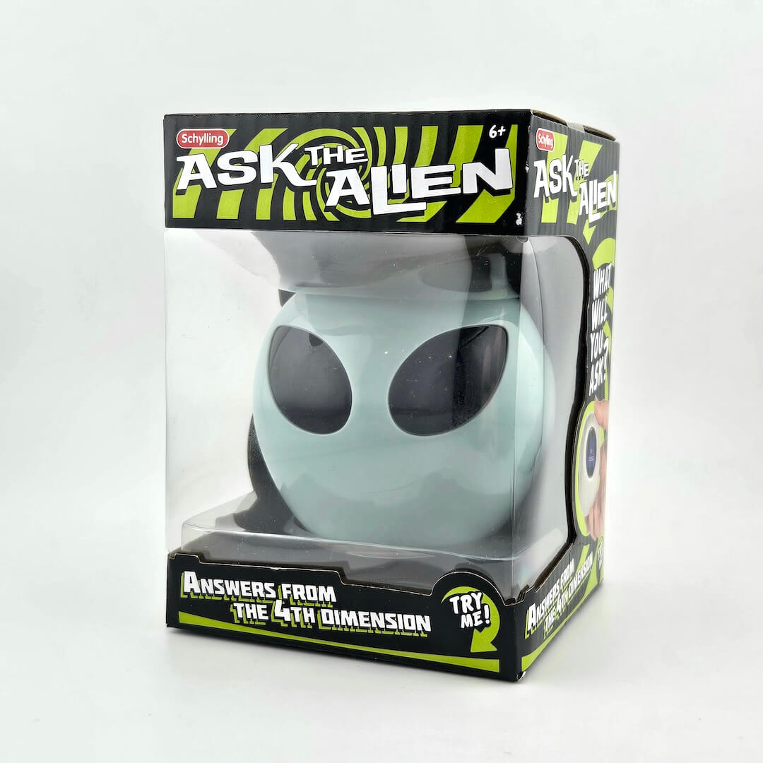 Toy alien figure in packaging with 'Ask the Alien' branding on a white background