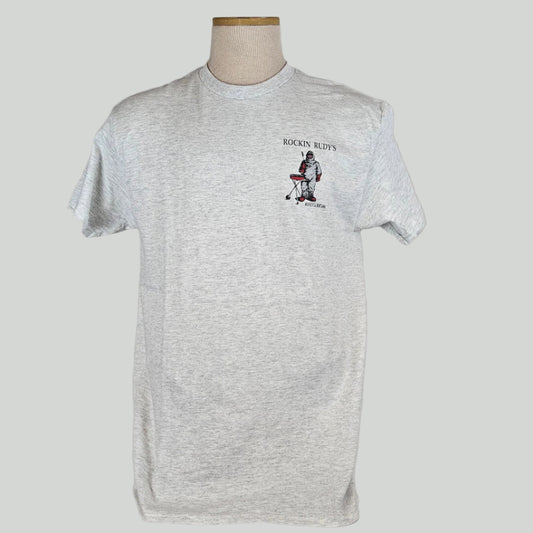 Heathered gray t-shirt with "ROCKIN RUDY'S" at top with man in hazmat suit grilling a record, city name at bottom on breast. 