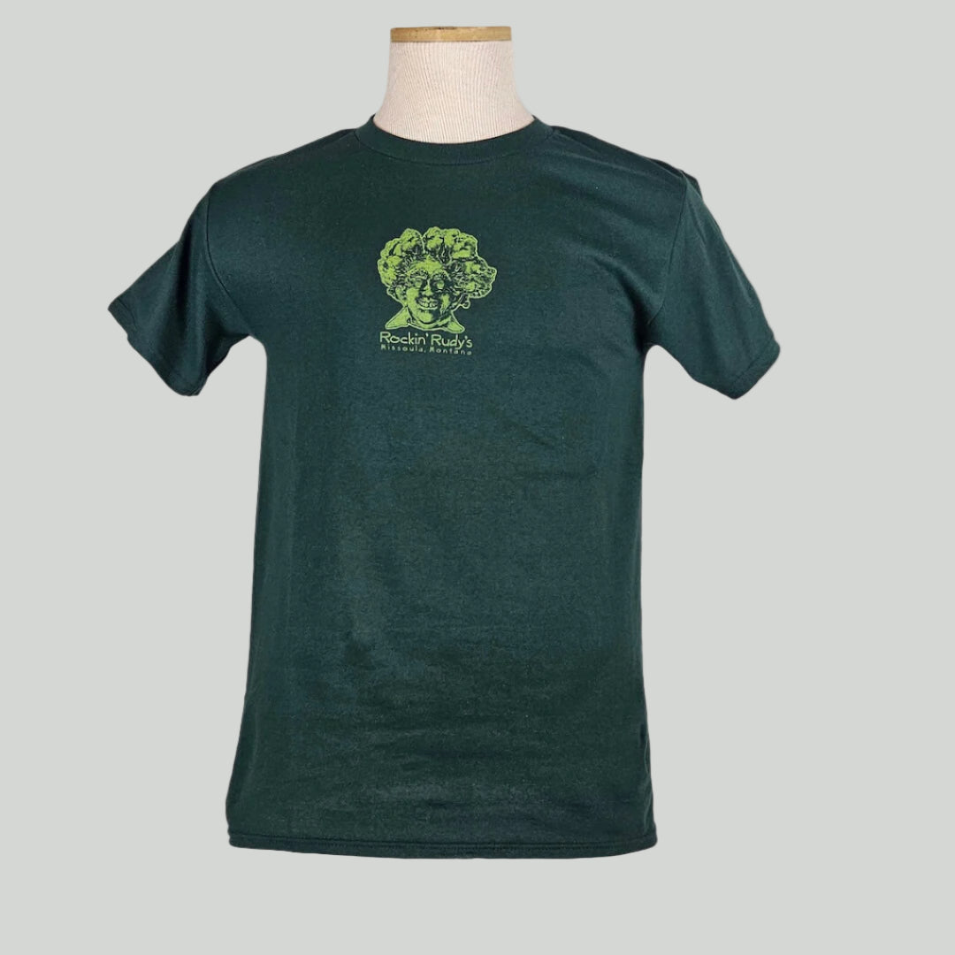 Green shirt with smiling man’s head with trees for hair, "Rockin Rudy's, Missoula, Montana," printed below in center chest.