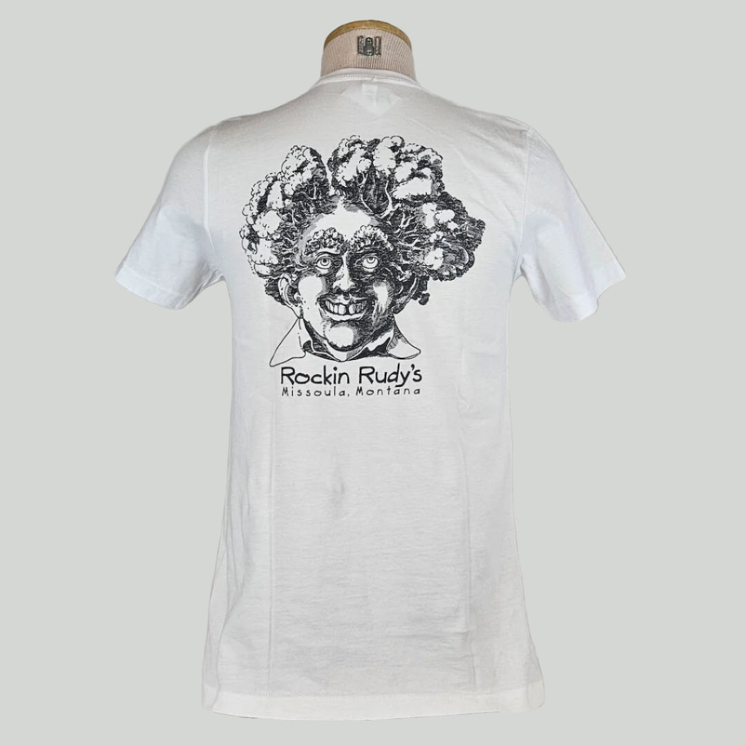 White shirt with large smiling man’s head with trees for hair, "Rockin Rudy's, Missoula, Montana," printed below in center.