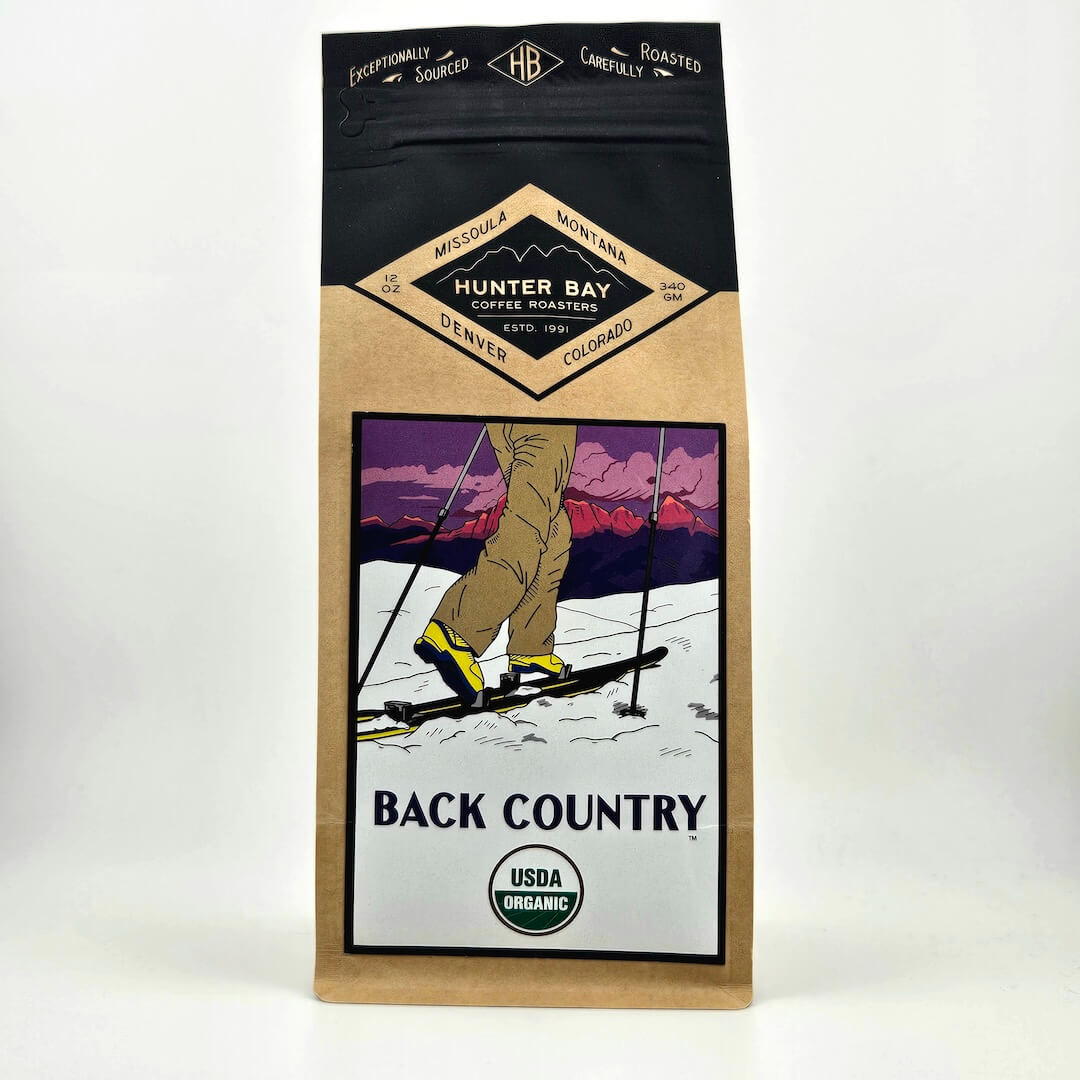 Coffee bag from Hunter Bay Coffee Roasters with a skier illustration on a white background