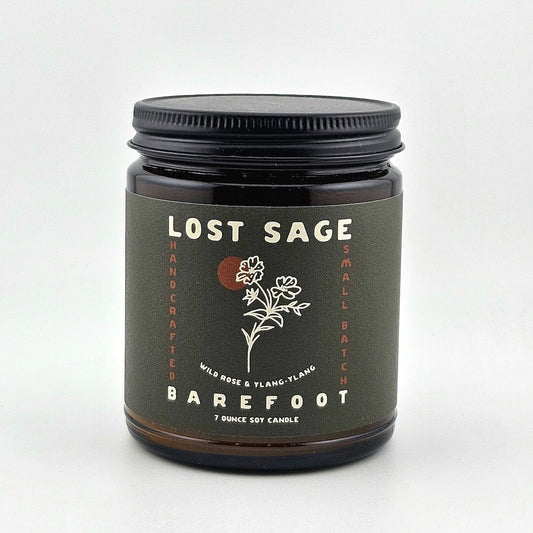 Candle jar labeled 'Lost Sage, Barefoot' on a white background