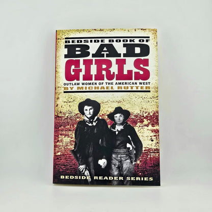 Book cover of 'Bedside Book of Bad Girls' with two women in cowboy hats on a textured background.