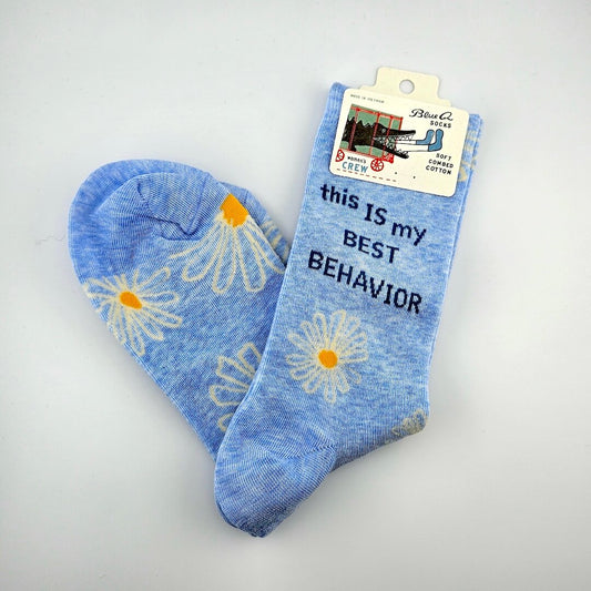 Blue socks with daisy flowers and text on a white background
