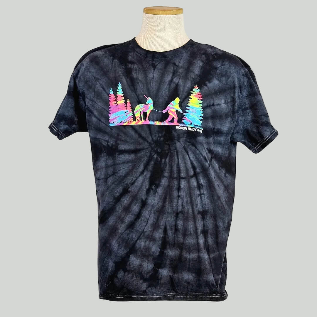 Black tie-dye t-shirt with colorful graphic on a mannequin against a white background