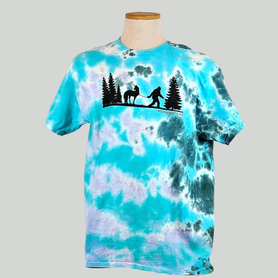 Tie-dye t-shirt with a graphic design on a mannequin against a plain background