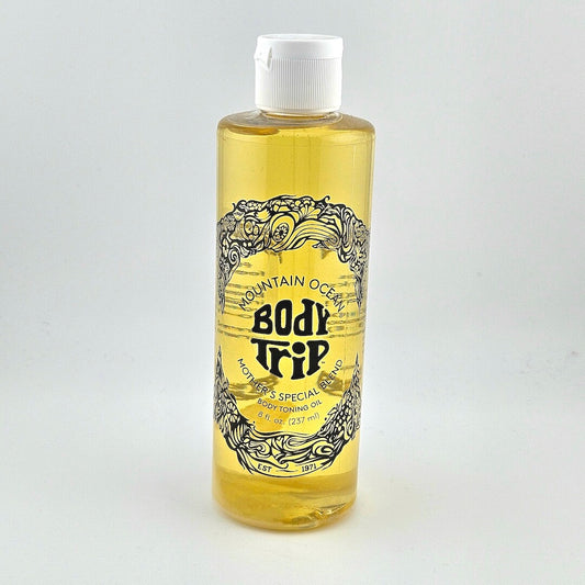 Bottle of Mountain Ocean Body Trip oil on a white background