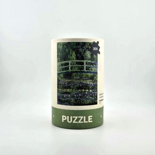 Jigsaw puzzle box with a scenic design on a white background