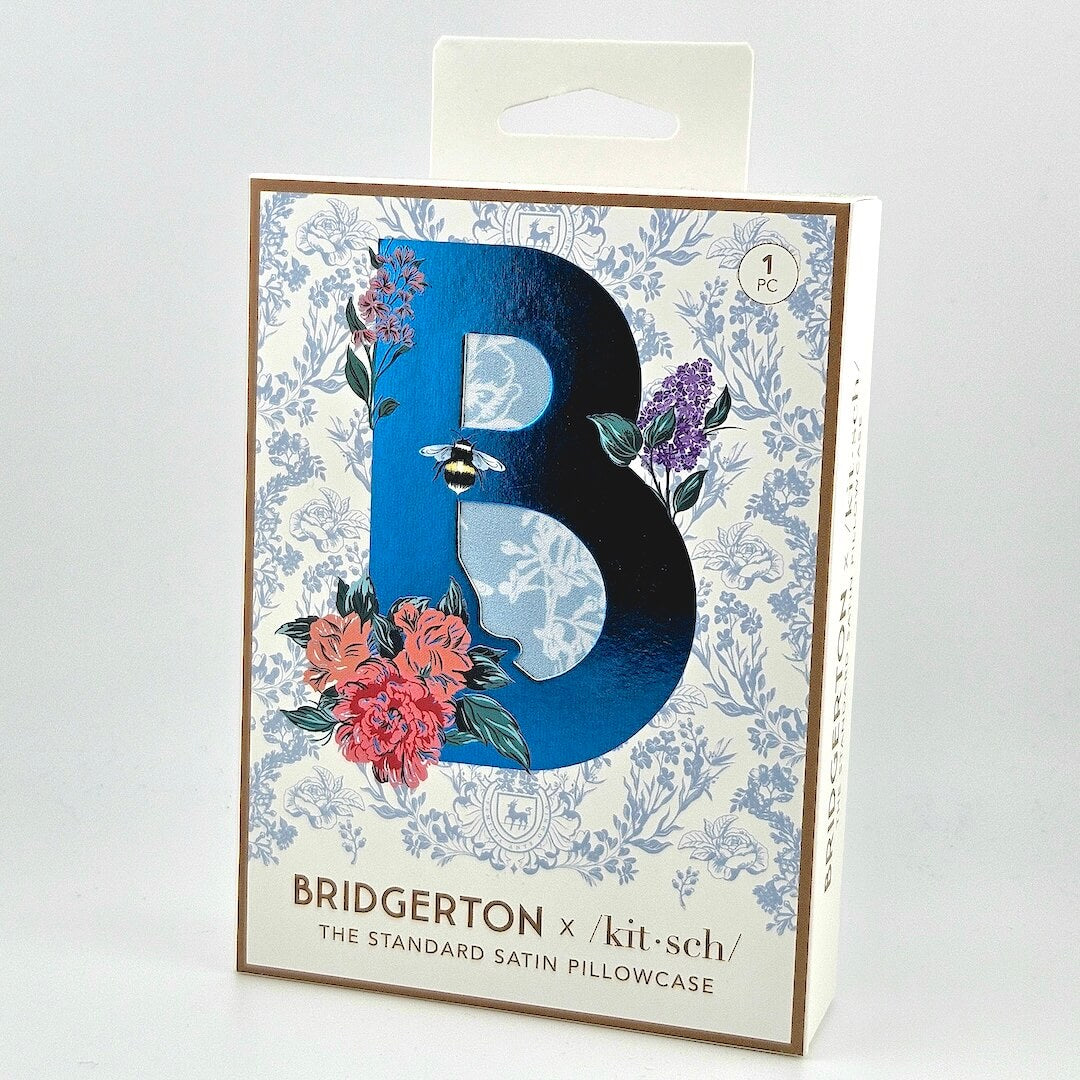 Floral box with blue "B" for satin pillowcase against white background.