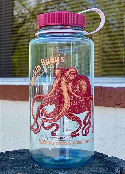 Light blue water bottle with pink lid, main image of octopus in red/orange, "Rockin Rudy's, Missoula, MT" above. Store behind