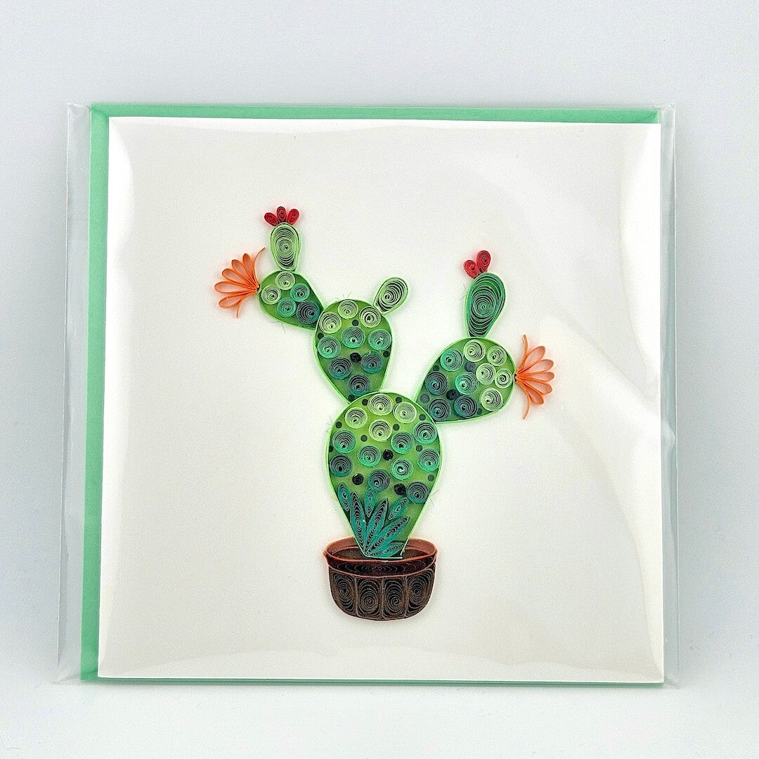 Quilled cactus art on a white card with a green border