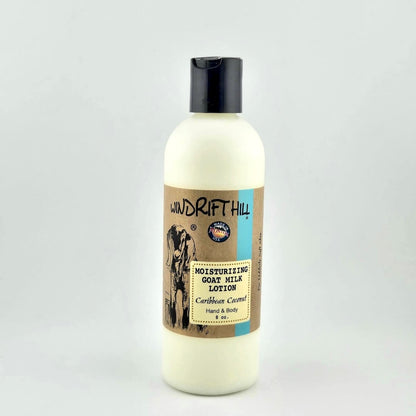 Plastic bottle of Windrift Hill moisturizing goat milk lotion on a gray background